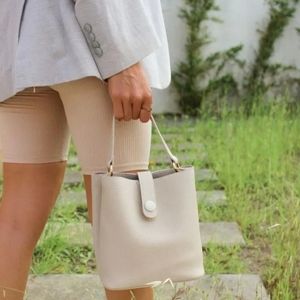 Tijn Guna Beige top handle bucket bag